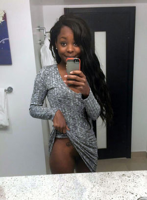 Sexy black girl flashing her round ass