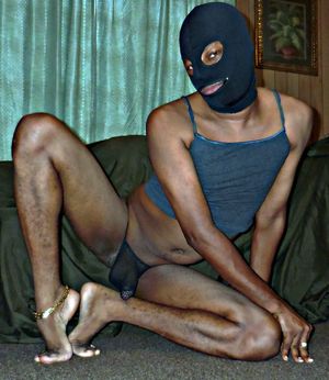 Sissy black boy in the mask shows his