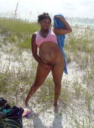 Old ebony mom posing nude on fresh air